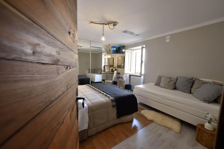 double family room with sofa bed on the 1st floor and view of the village