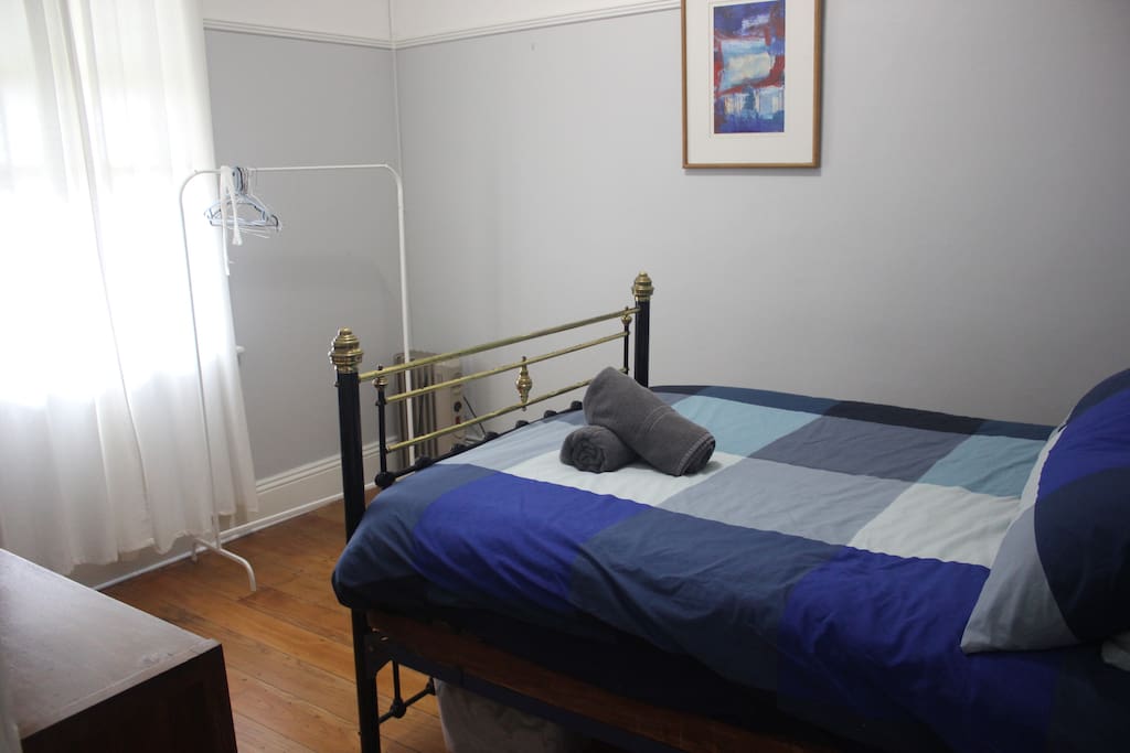 Bedroom 1: double bed, simple furnishing, clothes rack, electric heater and electric blanket