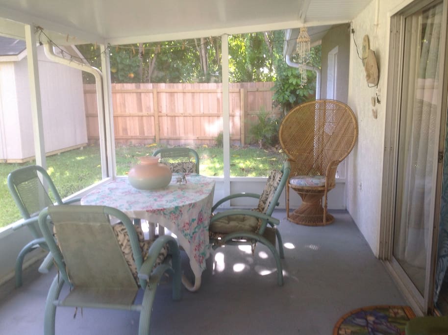 Warm & Sunny screened in back patio area