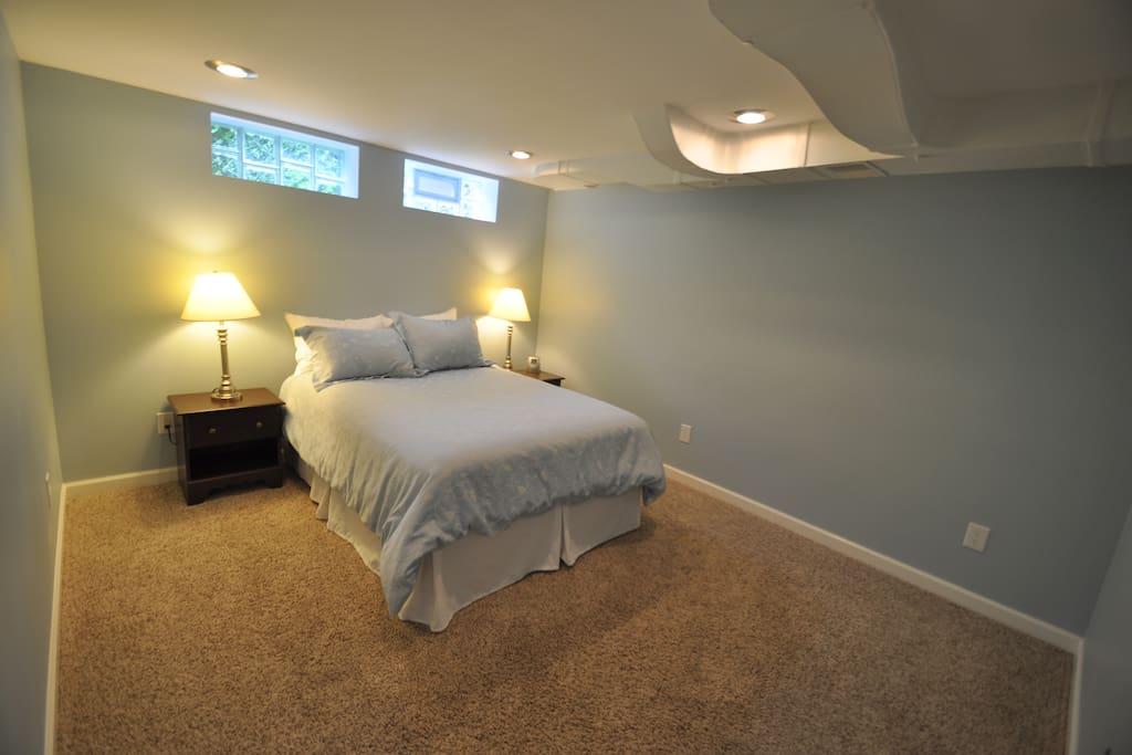 Private bedroom with closet and queen bed.