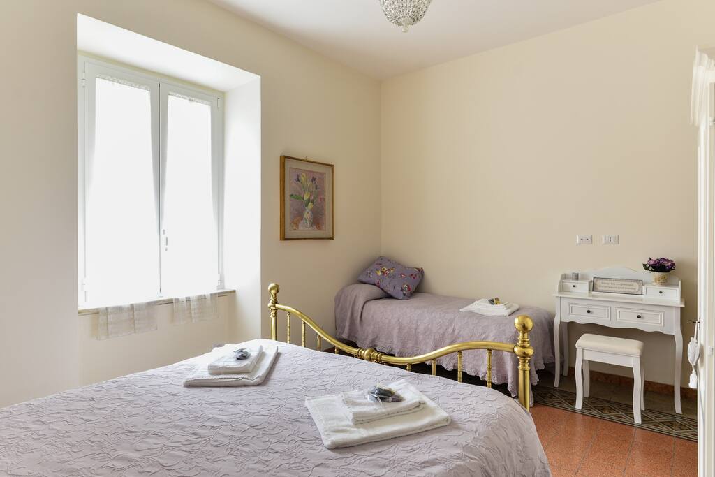 The main bedroom has a king size bed and a single bed