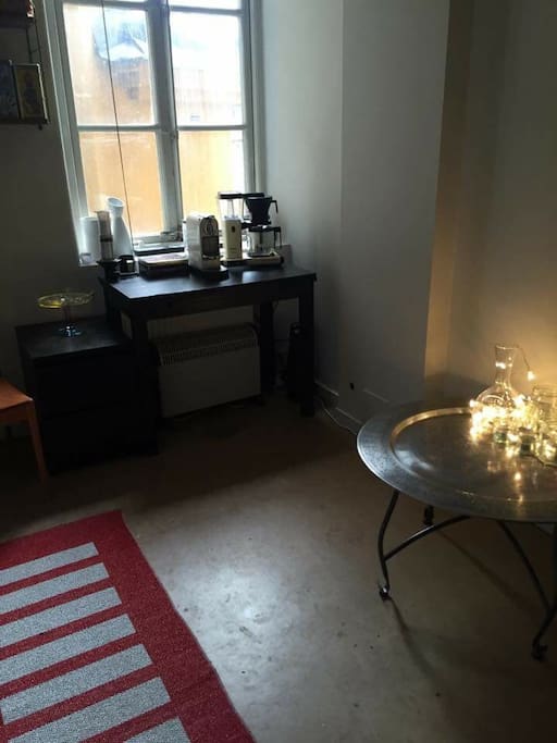 One side of the kitchen. Instead of the round table there is now a dining table with four seats