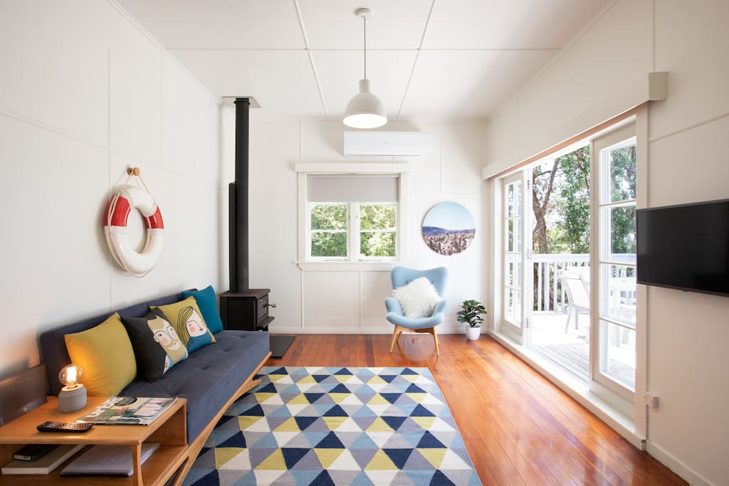 Lounge with polished Matai floors and French doors opening out to a good-sized deck for Alfresco dining.