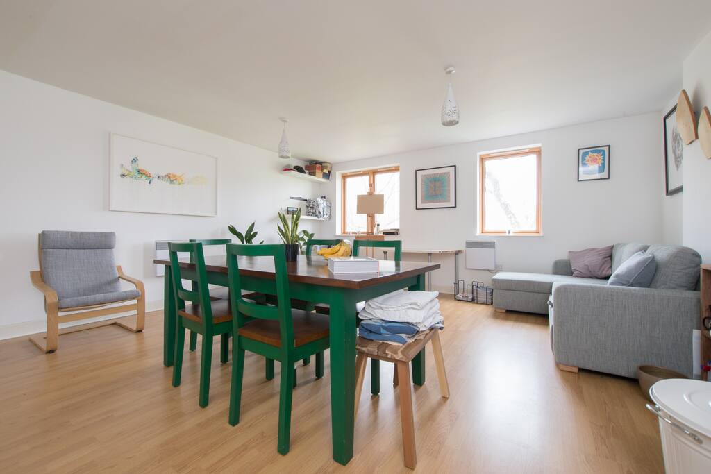 The spacious and well lit living room looks out over a park, Meath Gardens