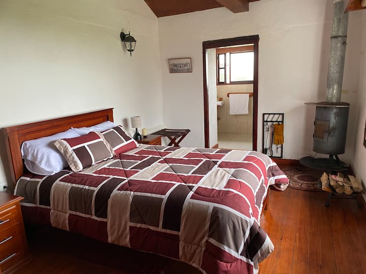 Bedroom 3 with a double bed, fireplace and bathroom