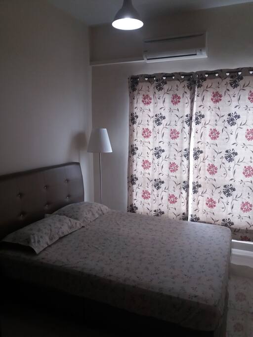 Bedroom furnished with Queen bed, Curtains and Air con