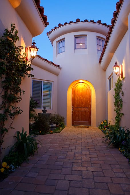 Gated entry past Casita to dramatic foyer