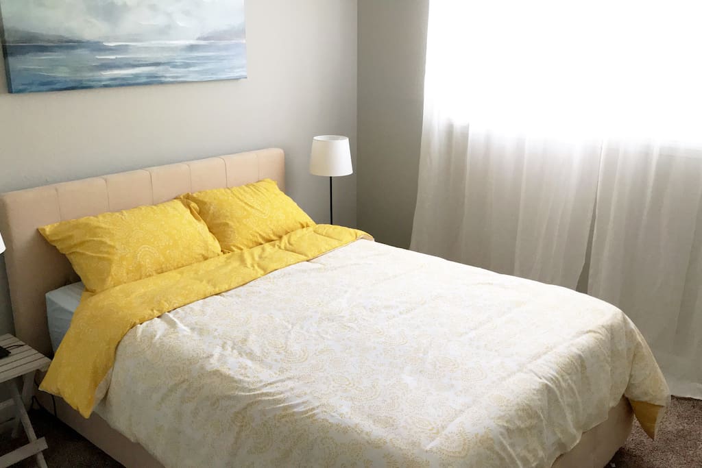 The second bedroom, with a full-sized memory foam mattress, and its own built-in closet.