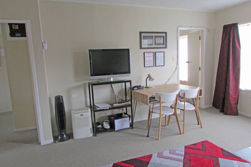 TV, info sheets and table/desk for two