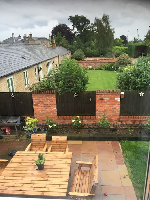 Courtyard with large table, breakfast can be served here in the summer , weather permitting.