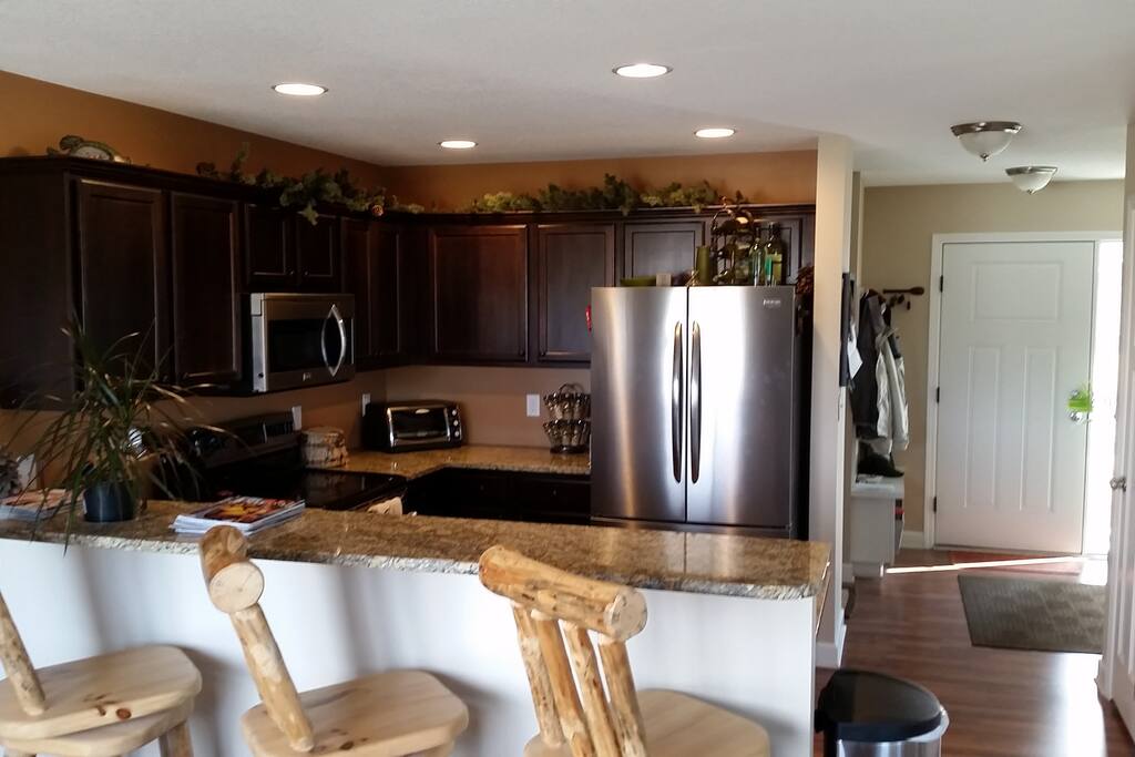 Kitchen. Check out those Rustic Log Bar Stools!