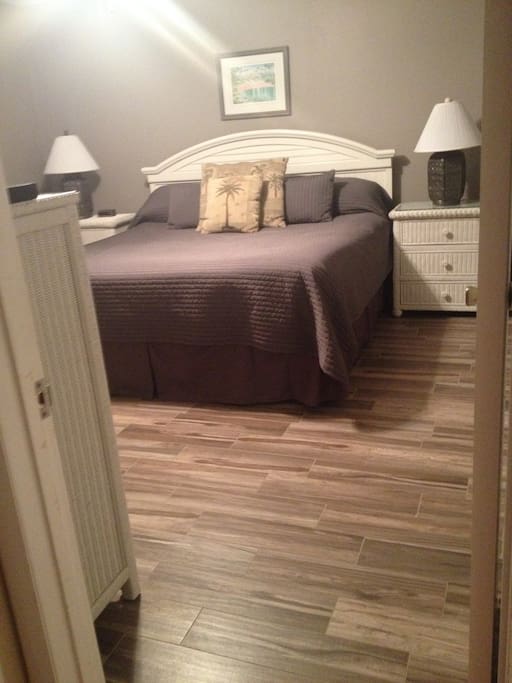 Master bedroom, tile floor and king size bed