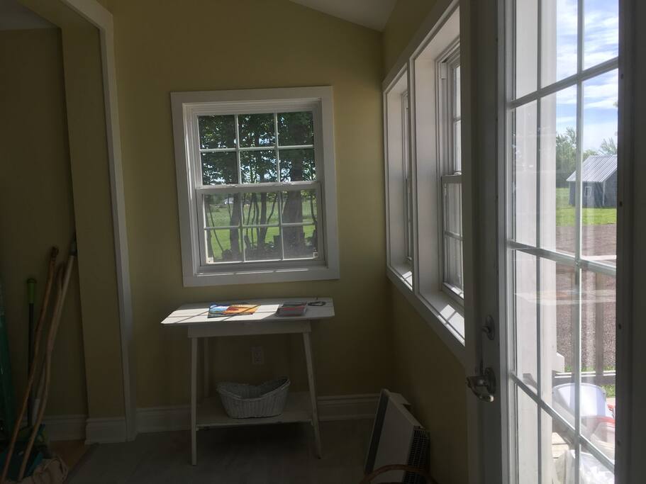 Entryway, sun room & reading area.
