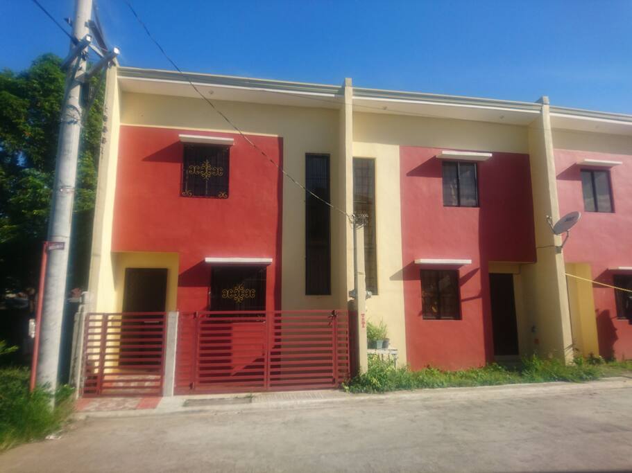 House has iron window grills and gate for added security