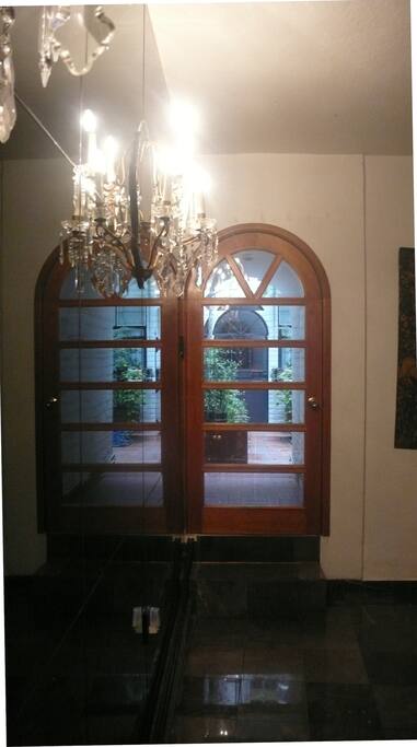 Private, direct entrance through softly lit garage.