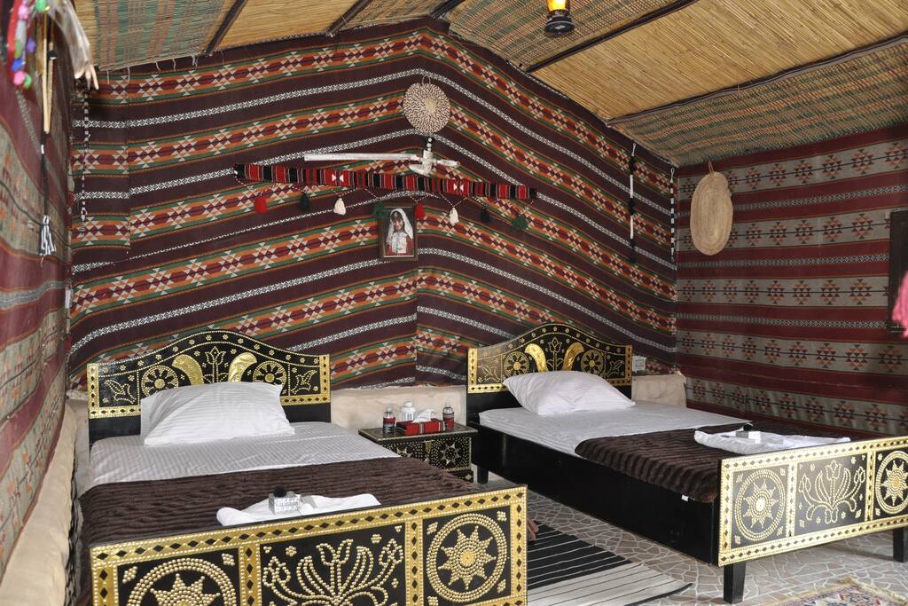 Executive Room - 2 Queen bed - Facilities : AC - Safe box -Mini bar Fridge + depended Toilet with water heater- Outdoor shaded Setting area - Bathing Supplies +Towels -Tea &Coffee maker + Intercom (Housekeeping assistant)+ Iron Facility .