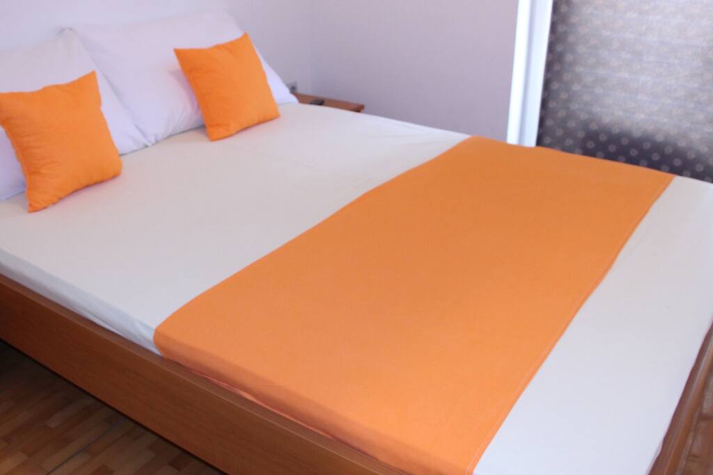 Bedroom with big comfortable double bed.