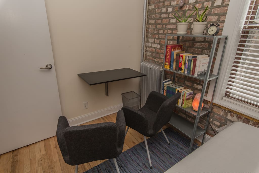 Desk unfolds from the wall for workspace or breakfast nook.