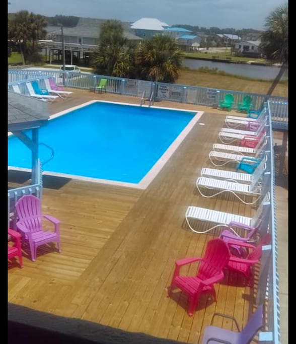Fabulous pristine pool with plenty of room and comfortable chase lounge chairs to relax.