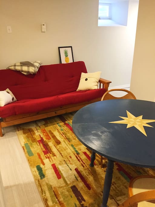 The pull-out futon with a new mattress.