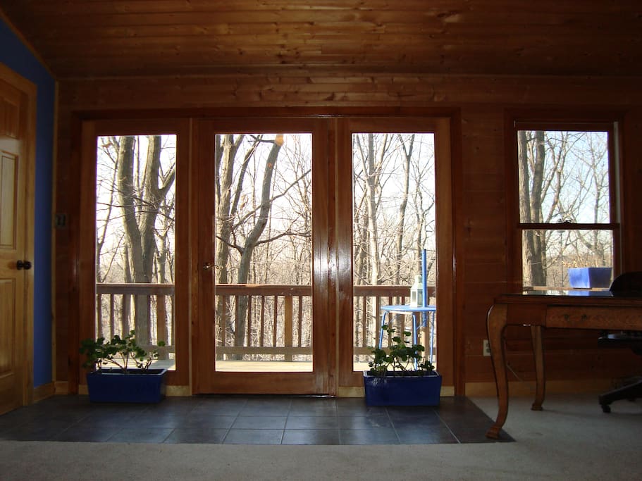 Window wall leads to elevated deck with western view of forest and lake. Peaceful retreat in canopy of the trees. AC, baseboard electric heat supplemented with ceiling fan/heater.