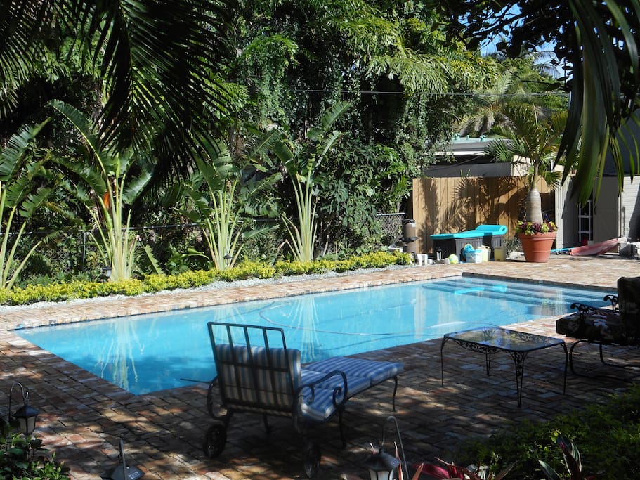 Private Pool with lounge chairs and table umbrella