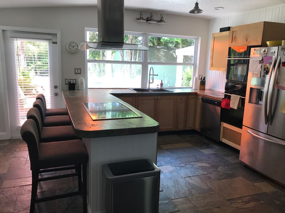 Chef's kitchen-stainless steal, top of the line appliances, breville toaster and juicer, French press, coffee machine, and Keurig machine.
