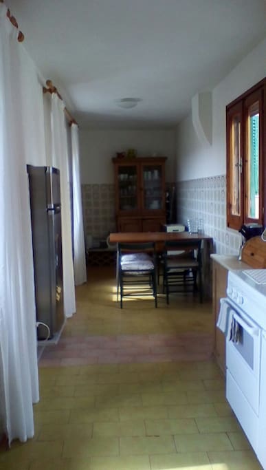 kitchen sits above entrance arch with views eitherside