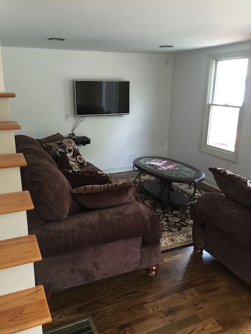 Furnished living room with basic cable and wi-fi.Views and slider to the private in-ground pool