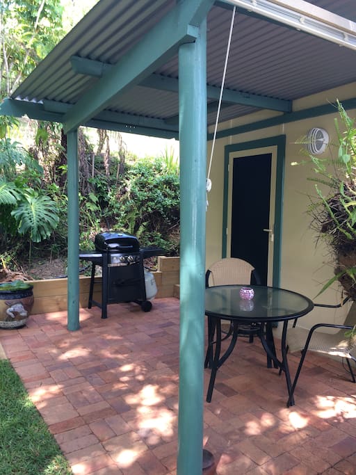 Outdoor paved area with gas bbq.