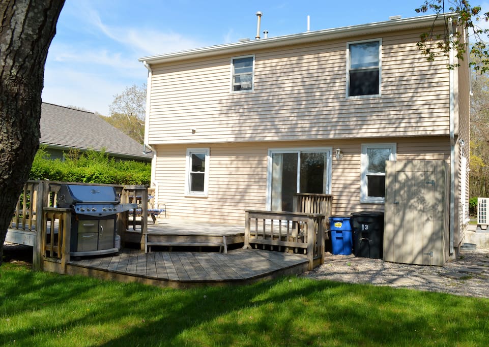 Sunny backyard and deck for grilling and relaxing. Use the outdoor shower for a warm rinse off. There's nothing like it!