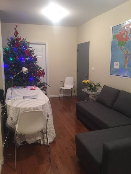 Living room with Xmas three to make you feel festive.