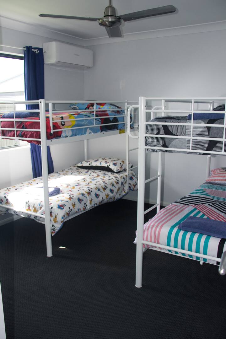 4 SINGLE BEDS with built in robes