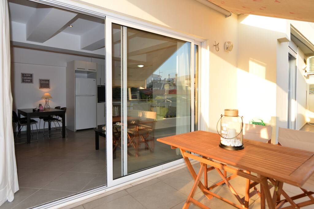 The apartement is at the top floor . Outdoors dining area