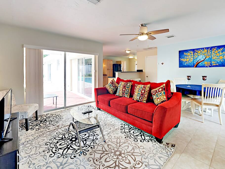Glass doors lead to the private patio and flood the main living area with natural light.