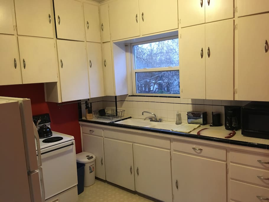 Fully stocked kitchen with microwave
