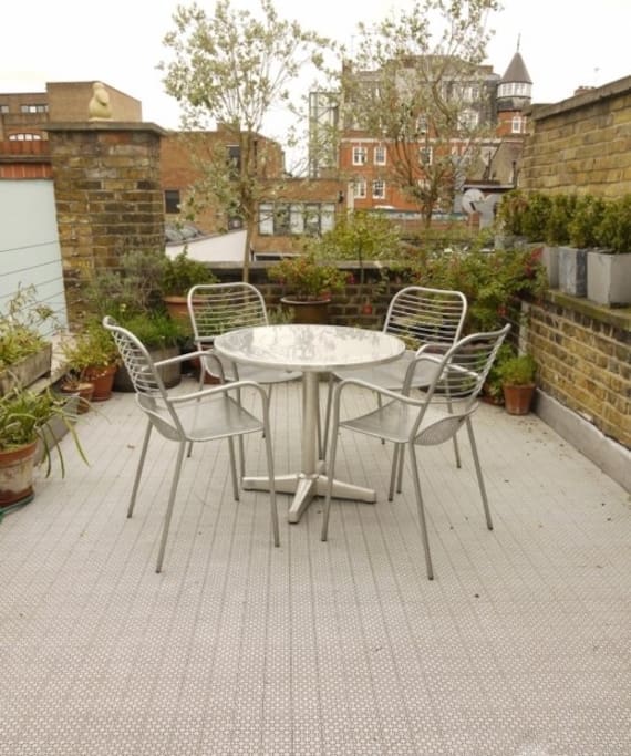Roof terrace overlooking other converted Victorian industrial apartments etc