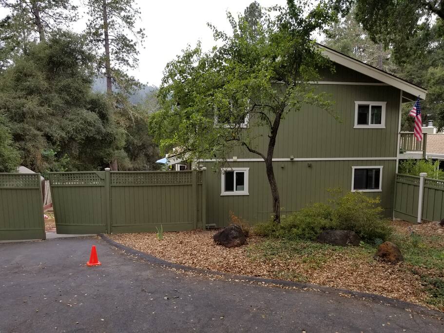 Your bedroom is downstairs; park in front of a red cone and enter the large green gate on left