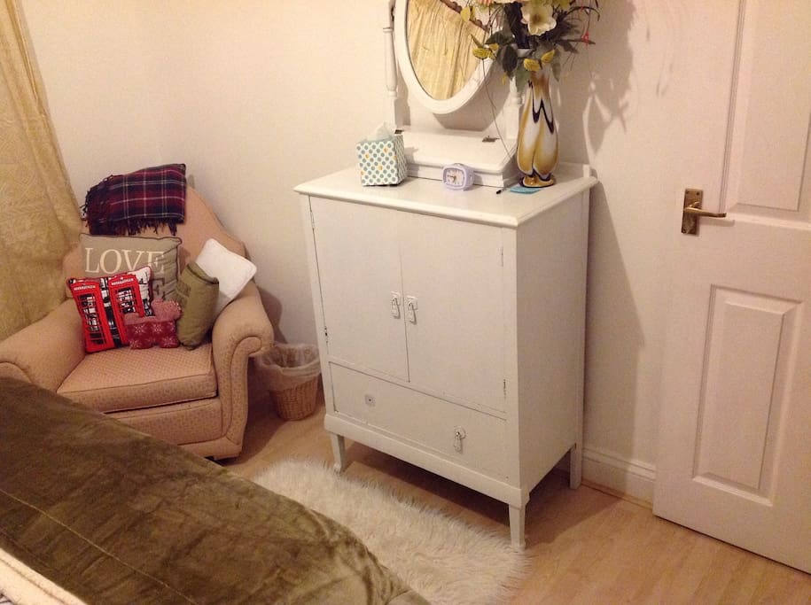 Mirror, dresser and armchair