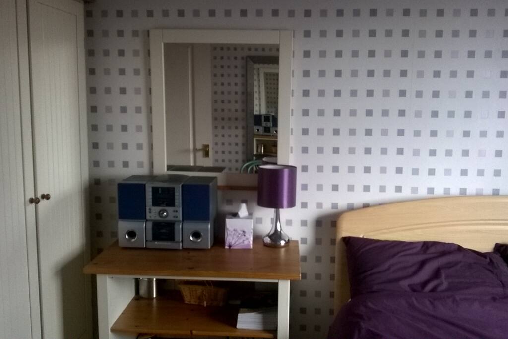 The room benefits from having a double wardrobe available and a reading lamp and music centre for guests use