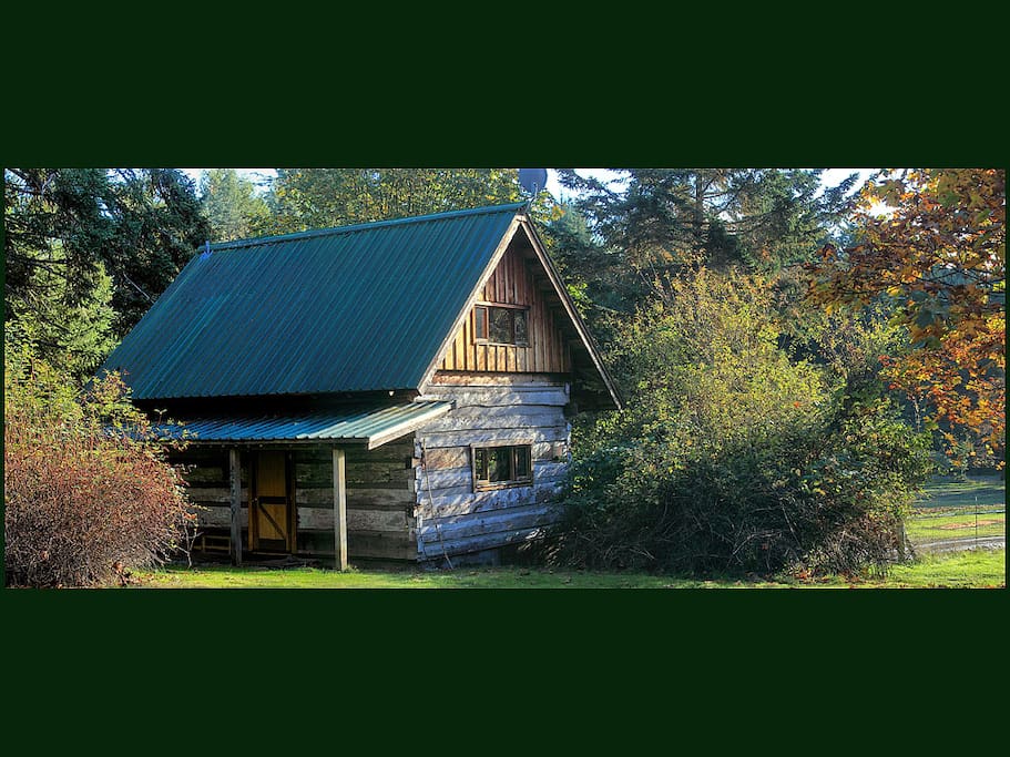 Galiano Island's Captain's Quarters 1894 Heritage Log House welcoming honeymooners and couples to a beautiful secluded southwest facing romantic getaway