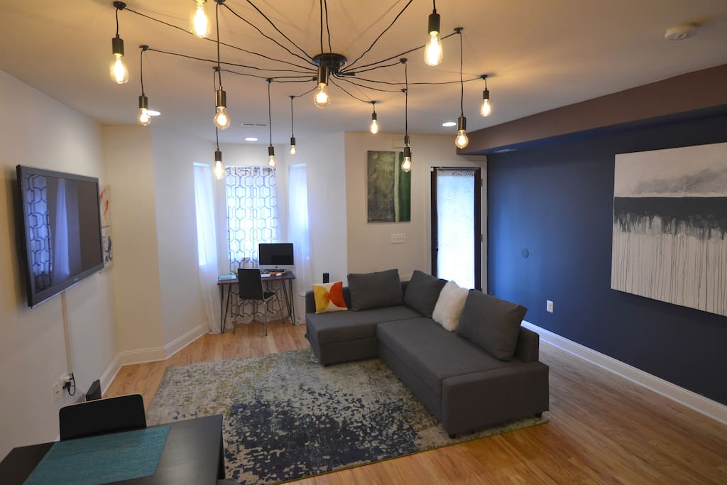 50" TV, iMac workstation, couch with queen pullout mattress