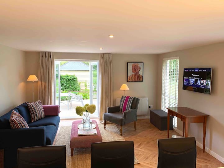 Living room - beautiful views over the garden and countryside. This is a relaxing space with Smart TV and Sofa bed 