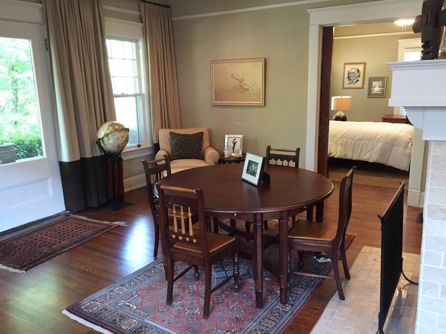 Dining room / front parlor. View of 3rd bedroom (back, right of picture) through large pocket doors that close for privacy.