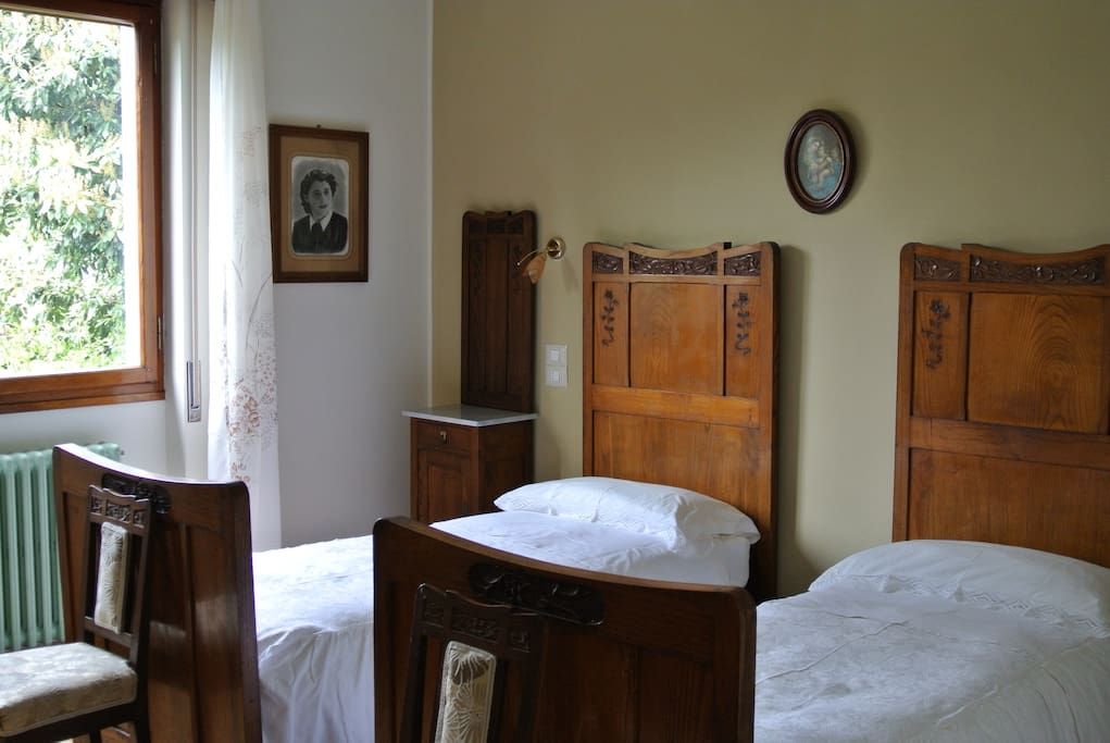 The twin bedroom with gorgeous original cherry-wood furniture from the early 1900's. Be reassured, the inner frame and the mattresses are modern and very comfortable