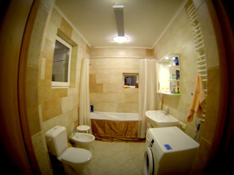 separate bathroom has shower, bath