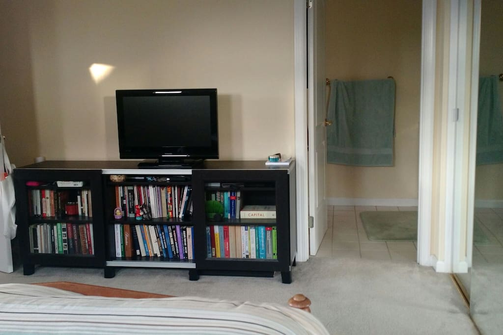 Master bedroom, with TV. TV has Chromecast support so you can watch while you lounge.