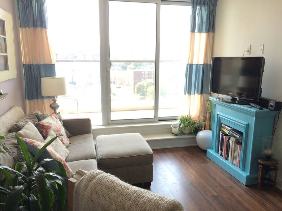 View of living room and balcony entrance from kitchen