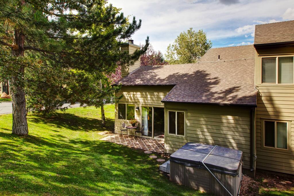 Hot tub and patio under the shade trees!