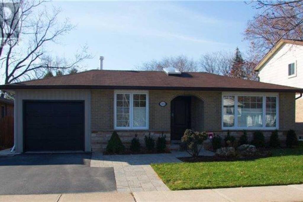Front view of home. Easily park 2 cars on driveway and one in garage.